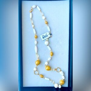 Vintage Cookie Lee long necklace approximately 17 inches long white and gold.